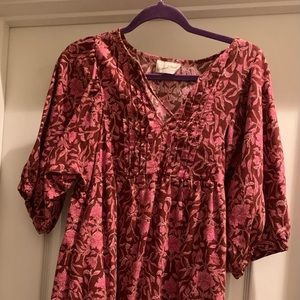 Maroon dress w/ pink floral print. 3 quarter length sleeves, knee height length.